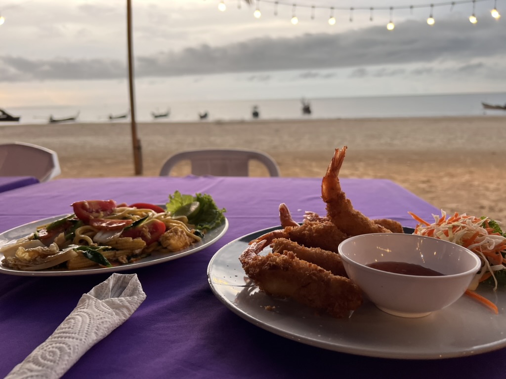 Eating seafood on the beach in Phuket Thailand